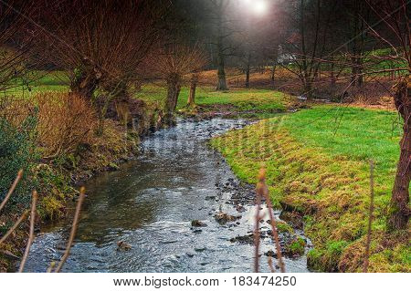 Clear water flows through a beautiful riverine landscape.