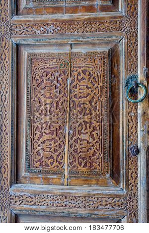 Old wooden carved door Samarkand Registan Uzbekistan