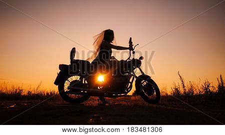 Silhouette Of Girl On A Motorcycle,