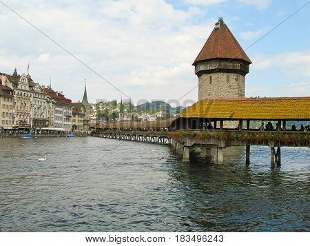 Wooden bridge Kapelbrucke and the Wasserturm tower, Lucerne, Switzerland.
