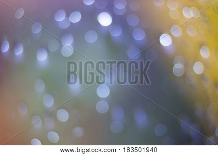 Beautiful fantasy backdrops colorful pastel bokeh blurred defocused dots soft lights background with selective focus.