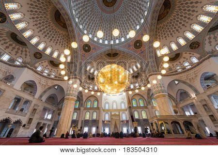 ANKARA, TURKEY - March 13, 2017: Kocatepe Mosque interior view during prayer.  The Mosque is the largest in Ankara and was built between 1967 and 1987.