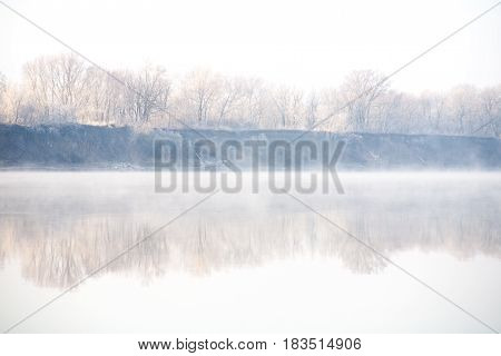 Morning on the river early morning reeds mist fog and water surface on the river