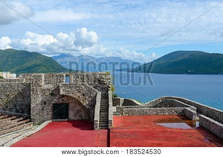 Fortress Kanli-Kula (Bloody Tower) against backdrop of Bay of Kotor and mountains Herceg Novi Montenegro