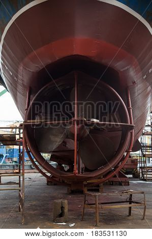 Slavynka Russia - April 21th 2017: Port Slavynka ship-repair factory sea ship-repair dock with a vessel in it the vessel screw.