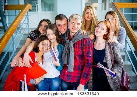 Group of university students meets on a stairway
