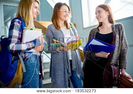 Group of university students meets on a stairway