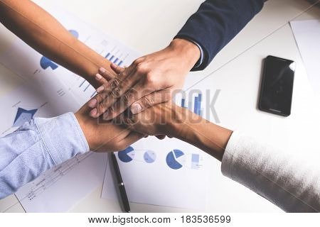 Image of business Concept of Teamwork people joining hands.