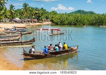 Ambatozavavy Nosy Be Madagascar - December 19 2015: Traditional wood pirogue with outrigger waiting for passengers in the fishing Ambatozavavy village on the Nosy Be island Madagascar.