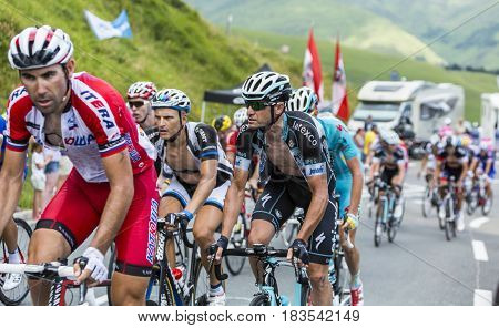 Col de PeyresourdeFrance- July 23 2014: The Italian cyclist Alessandro Petacchi of Omega Pharma-Quick-Step Team riding in the peloton (gruppetto) on the road to Col de Peyresourde in Pyrenees Mountains during the stage 17 of Le Tour de France on 23 July 2