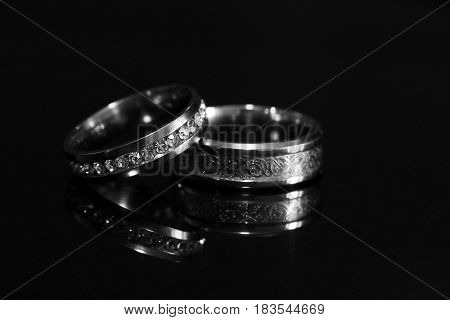 Wedding Rings On A Black Glossy Background