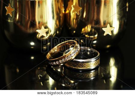 Wedding Rings On A Black Glossy Background