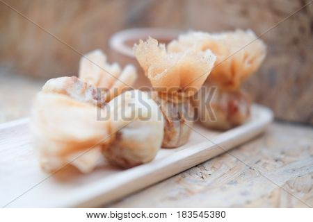 Asian appetizers with sweet chili sauce. Thai called 