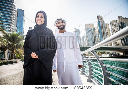 Arabic couple with traditional clothes dating outdoors