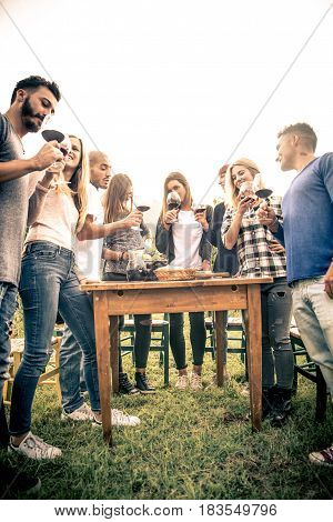 Group of friends at restaurant outdoors - People having dinner in a home garden