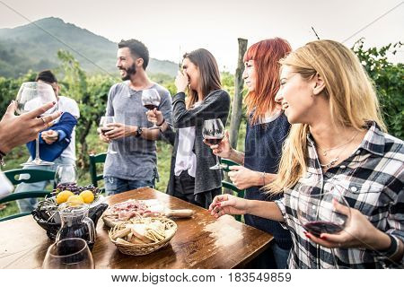 Group of friends at restaurant outdoors - People having dinner in a home garden