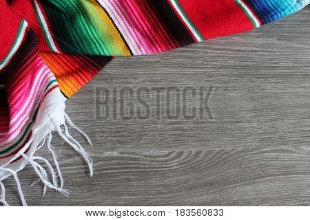 poncho serape background Mexican cinco de mayo fiesta wooden copy space