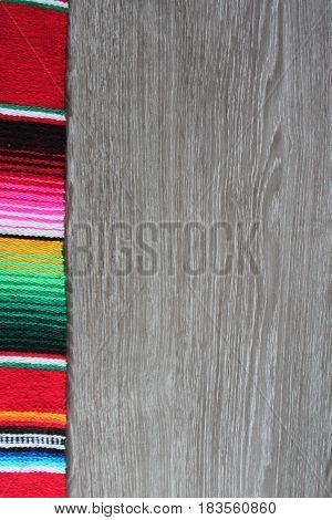poncho serape background Mexican cinco de mayo fiesta wooden copy space