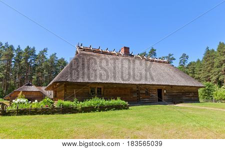 RIGA LATVIA - JUNE 13 2016: Living rural house (circa 1848) of Veskerves farmstead of Kurzeme ethnic group. Exhibited in Ethnographic Open-Air Museum of Latvia since 2001