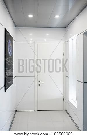 Modern home hallway interior. White plactic panels and tiles. Futuristic interior concept design. Space ship at home. Elements of this image furnished by NASA.