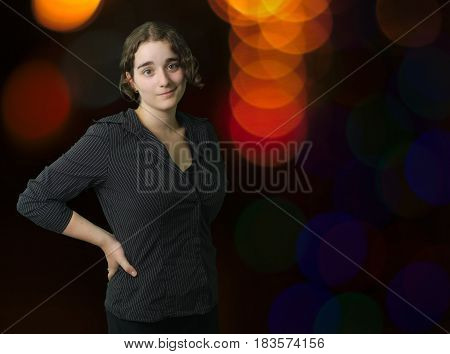 corporate business woman portrait wearing black office dark studio background with city lights downtown