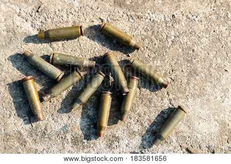 Shot cartridges from the machine gun on concrete cartridges from AK