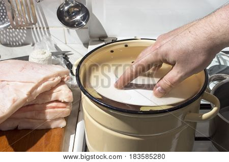 Preparation raw meat for smoking. Pork neck meat and bacon. Picking raw meat in brine. Soaking of meat in brine
