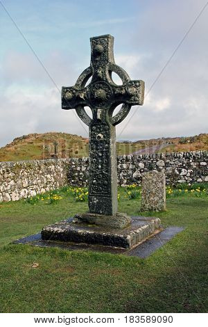Ancient Celtic Christian cross in old Kildalton churchyard Isle of Islay Scotland.