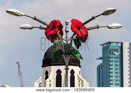 Statue With Flowers In Kuala Lumpur, Malaysia
