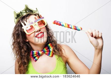Young woman having fun. Young pretty woman with crown is laughin