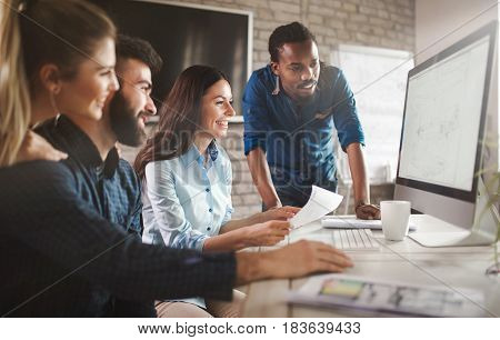 Software engineers working on project and programming in company