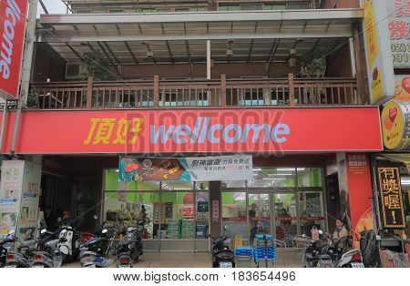 TAIPEI TAIWAN - DECEMBER 5, 2016: Unidentified people visit Wellcome supermarket. Wellcome is one of the two largest supermarket chains in Hong Kong operating also in Asia.