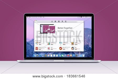 Directly front view of Apple MacBook Pro Retina with an open App Store on purple background. Varna Bulgaria - November 03 2013.