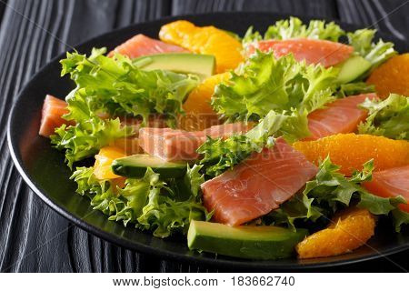 Delicatess Salad Of Salted Salmon, Oranges, Avocado And Lettuce Close-up. Horizontal