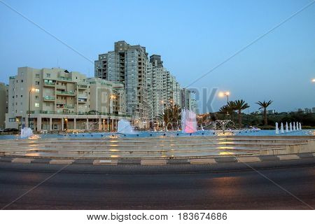 Ashkelon seaside park fountains colored evening light