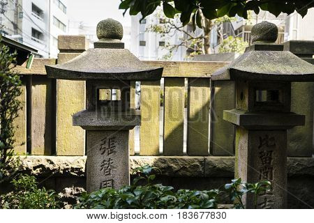 Stone carvings in a Shinto shrine in Tokyo Japan -
 neighbourhood of Asakusa