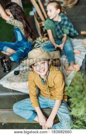 Adorable Little Kids Travelers Sitting Together With Map On Porch