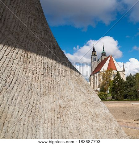 Flag monument and St. Johannis-Church on the banks of the river Elbe in Magdeburg.