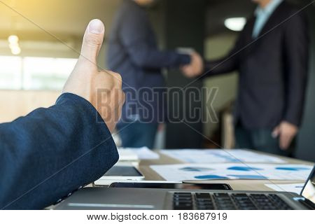 Image of businessmans handshake. Successful businessmen handshaking after good deal.