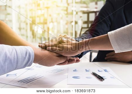 Image of business Concept of Teamwork people joining hands.