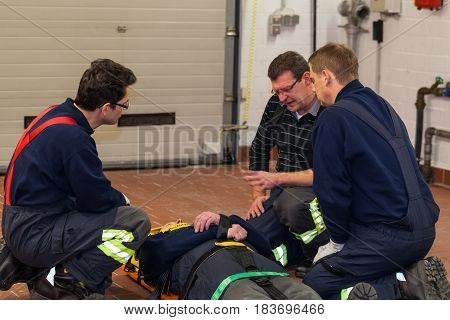 Hamburg, Germany - February 07, 2013: German firefighter team in an exercise with a injured in a stretcher