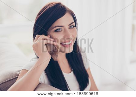 Close Up Portrait Of Beautiful Brunette Woman Talking On The Phone. She Is Ecxited To Hear Good News