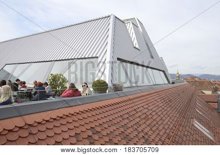 GRAZ, AUSTRIA - MARCH 20, 2017: People at sky bar and roof of the Kastner and Ohler warehouses in Graz the capital of federal state of Styria Austria.