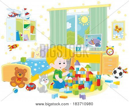Little boy playing with bricks in his room