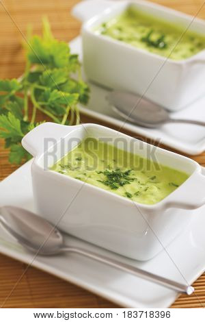 Homemade green sauce in rectangular bowls on atable.