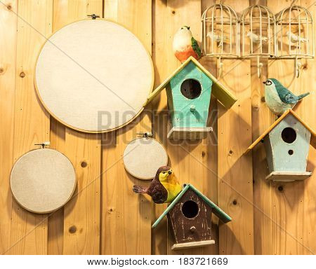 BIrd hosue and board with wood background
