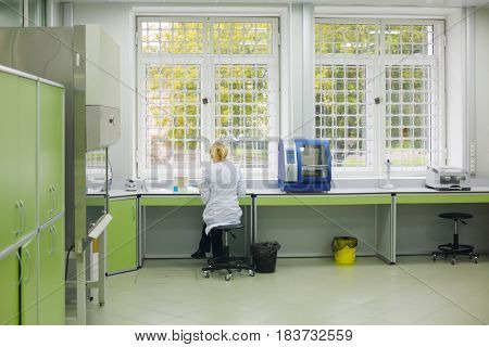 MOSCOW - SEP 22, 2016: Woman works in laboratory of Forensic Center at Petrovka, 38, Main Department of Moscow Ministry of Internal Affairs