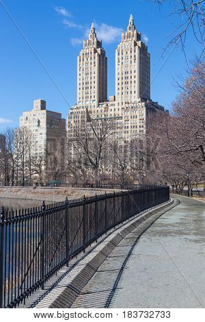 New York City - Panoramic view of modern buildings of upper west side Manhattan from Central Park with Jacqueline Kennedy Onassis Reservoir.