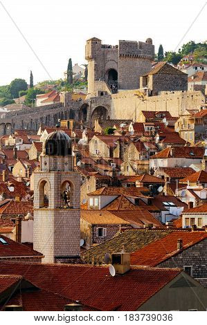 Bell tower, Minceta tower and houses with red tiles in Dubrovnik, Croatia.