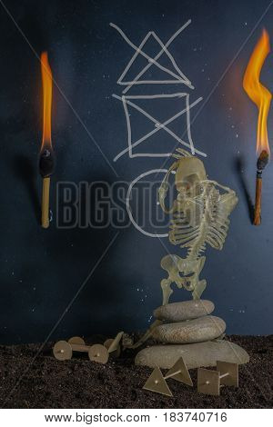 invention of the wheel. skeleton sitting at the ancient cave in torch light. image show creativity process. concept image